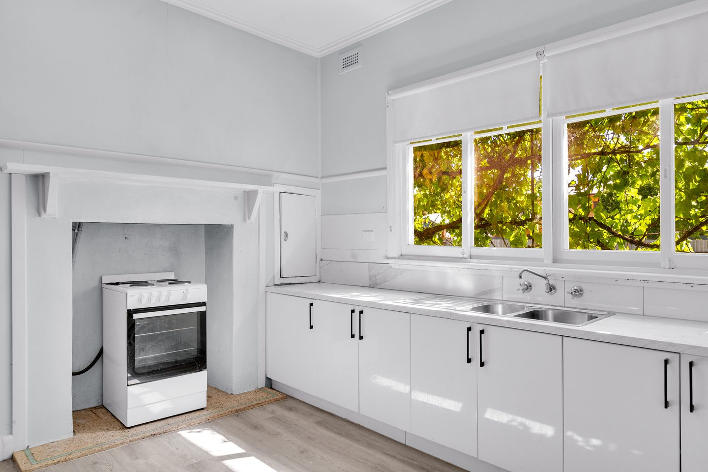 Kitchen bench, sink and cooker