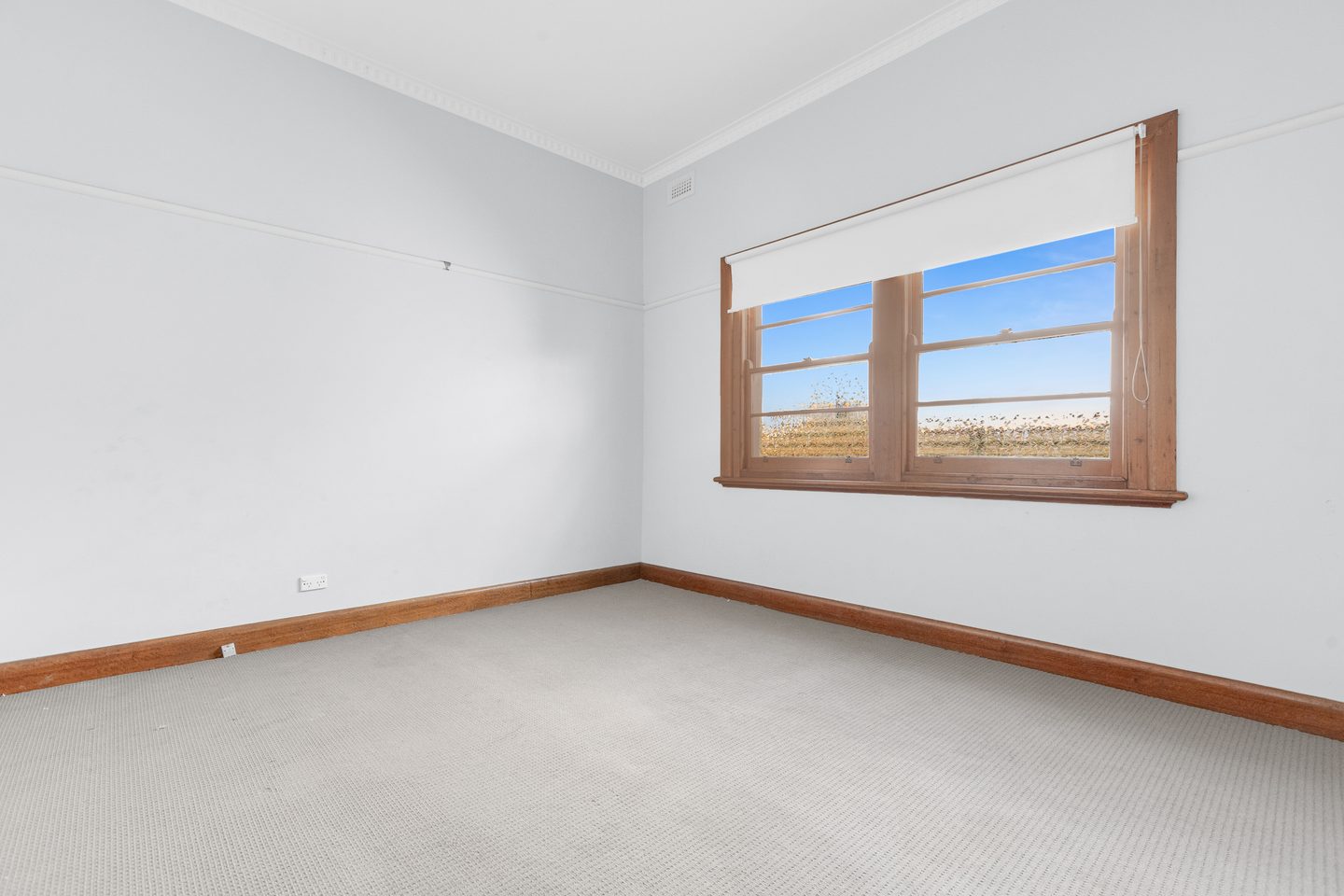 Bedroom with a timber-framed window