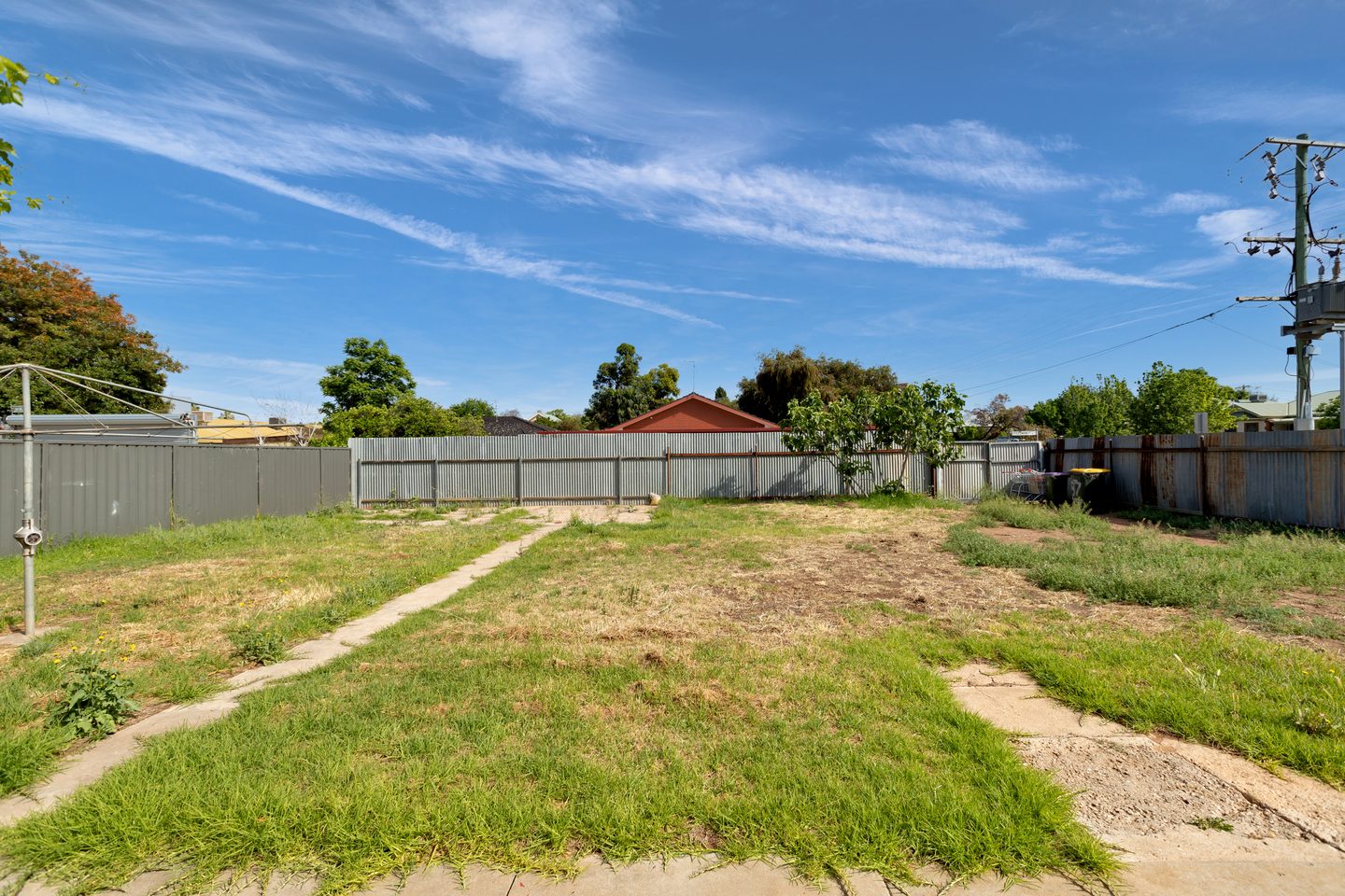 Open backyard and boundary fence
