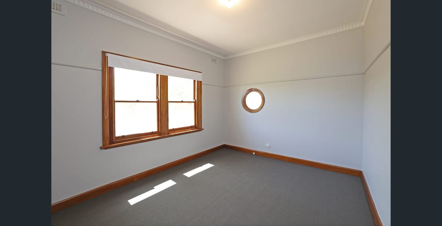 Bedroom with a circular window