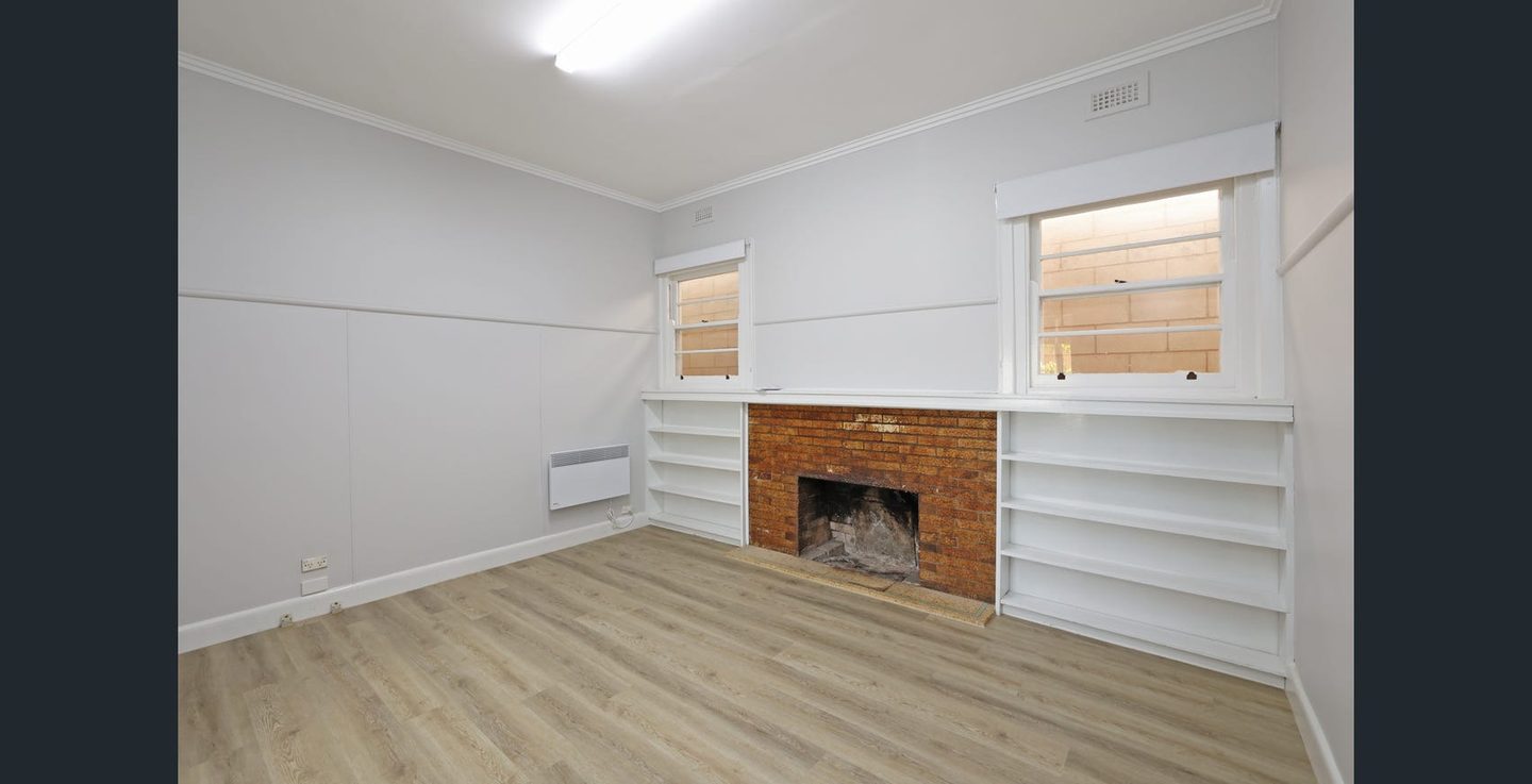 Dining room fireplace and shelving
